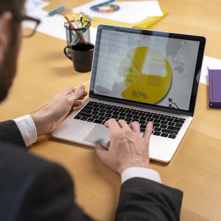 close-up-man-working-with-laptop